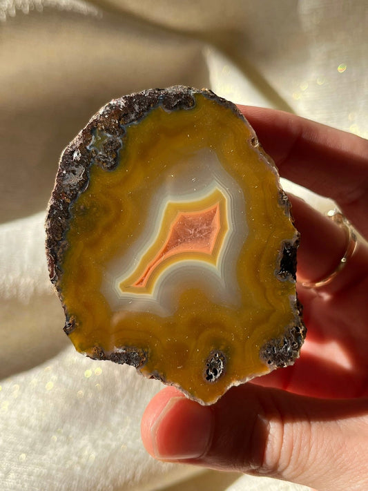Vibrant Orange Laguna Agate Specimen with Translucent Quartz Window